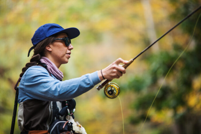 woman fly fishing in west virginia