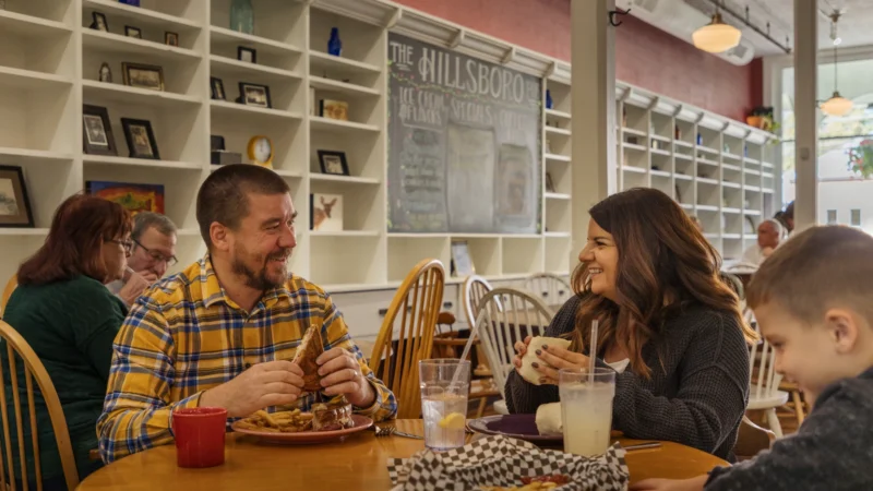 Family dining together at Hillsboro Pub, smiling and enjoying a meal