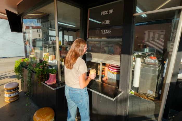 A woman ordering at the walk-up window at Dari-Land. 