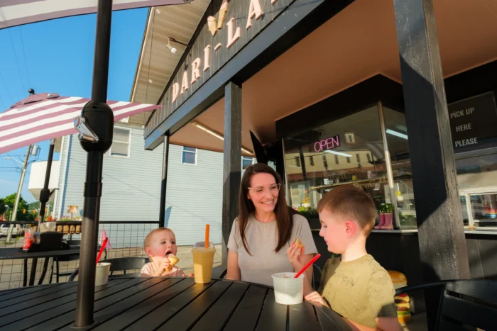 A family enjoys ice cream outside of Dari-Land.