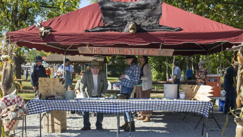 People under a tent at the West Virginia Roadkill Cook-off